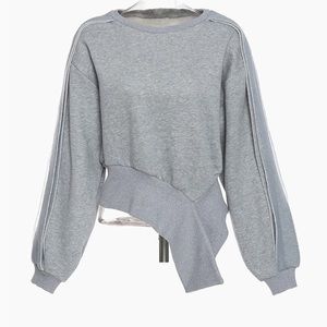 Asymmetrical hem sweat shirt with fleece lining.
